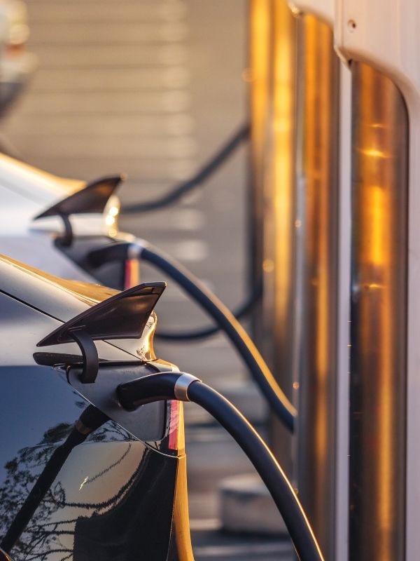 A picture of electric vehicles getting charged.